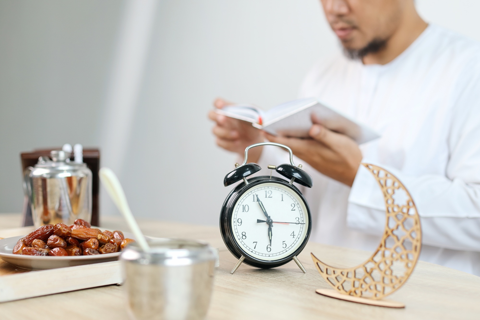 Man Reading Quran Before Iftar
