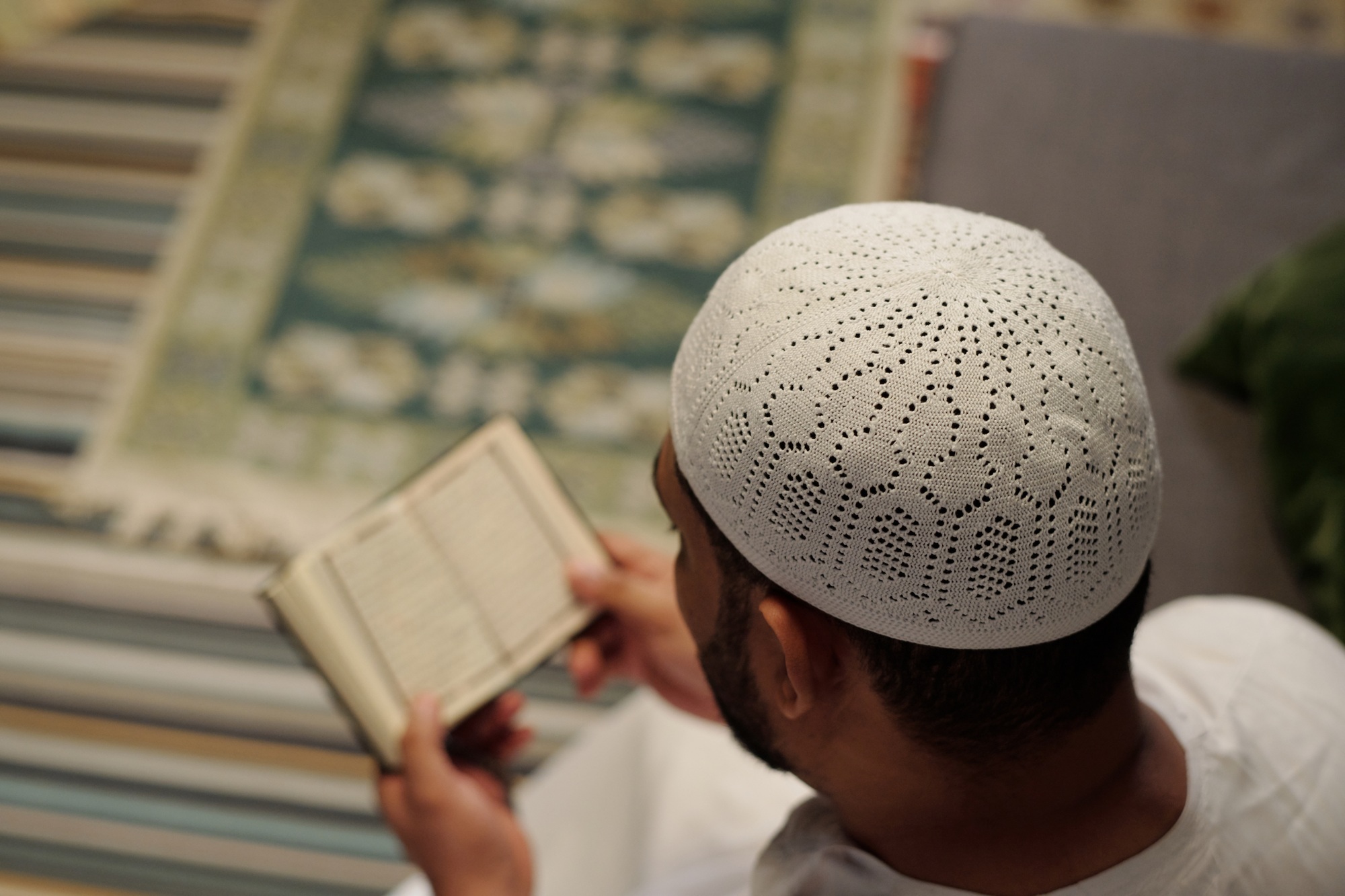 Unrecognizable Man Reading Quran Surah
